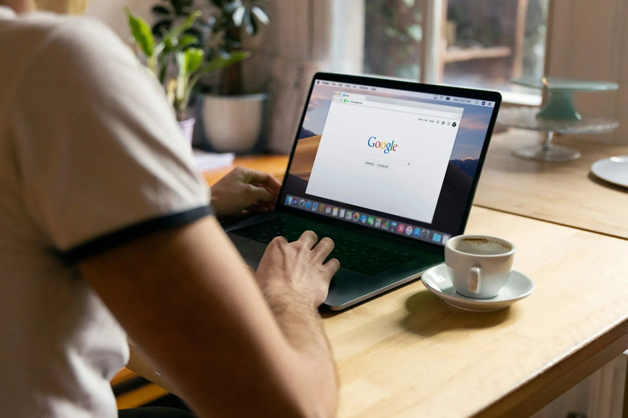 A laptop set up for paid search work in a café