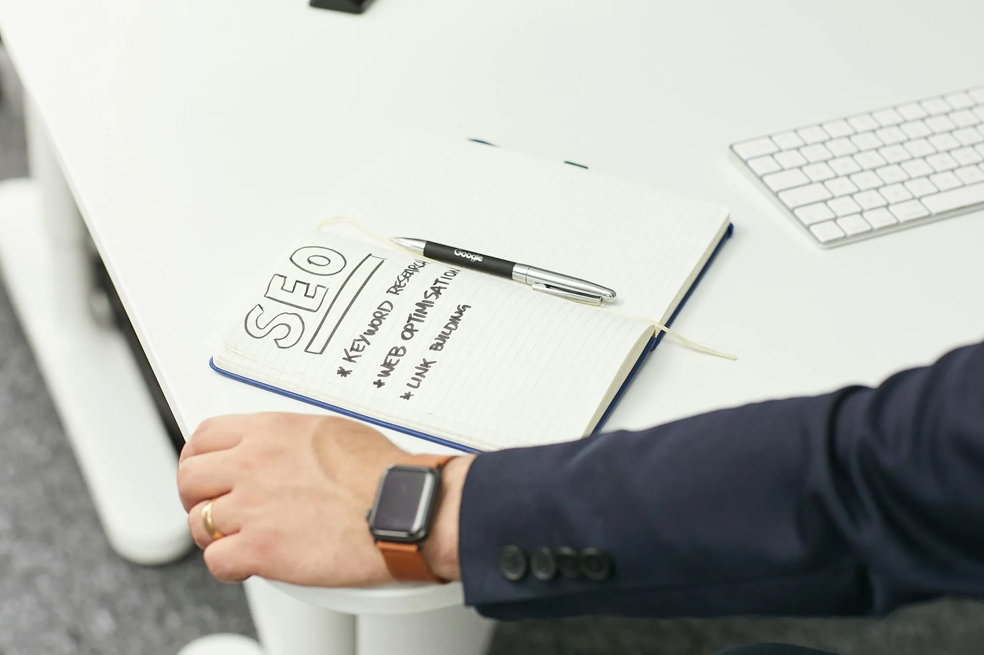 Planning notes being written by hand on paper